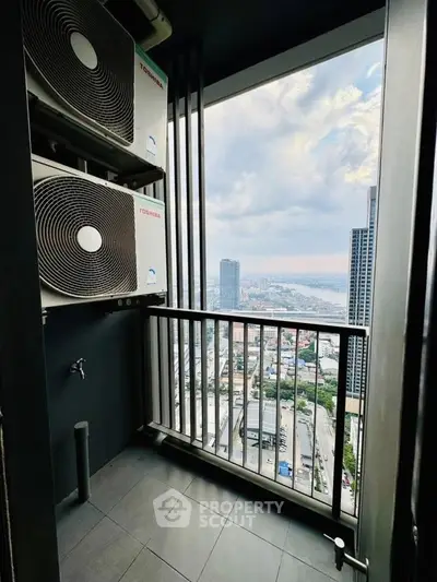 High-rise balcony with cityscape view and air conditioning units, perfect for urban living.