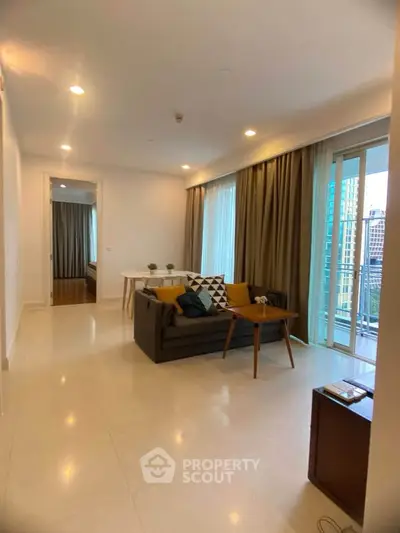 Spacious modern living room with balcony in urban apartment