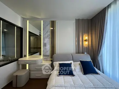Luxurious modern bedroom with elegant decor and plush bedding