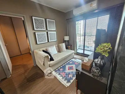 Cozy living room with modern decor and balcony view in stylish apartment