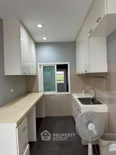 Modern kitchen with sleek cabinets and ample counter space