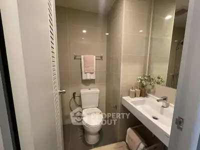 Modern bathroom with sleek fixtures and neutral tones