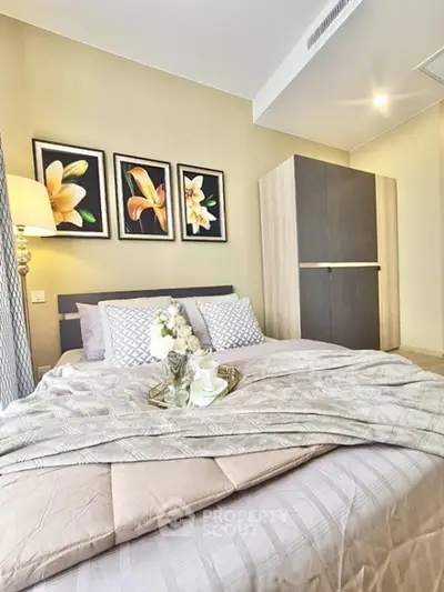Cozy bedroom with elegant decor and modern wardrobe, perfect for relaxation and comfort.