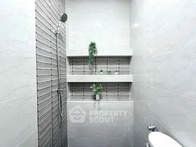 Modern bathroom with sleek shower and stylish tile design