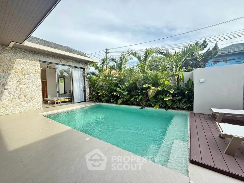 Luxurious villa with private pool and lush garden, perfect for relaxation and entertaining.