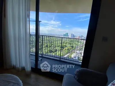 Stunning balcony view overlooking lush greenery and city skyline, perfect for relaxation and enjoying the outdoors.