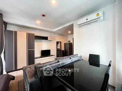 Modern living room with sleek furniture and air conditioning, perfect for comfortable urban living.