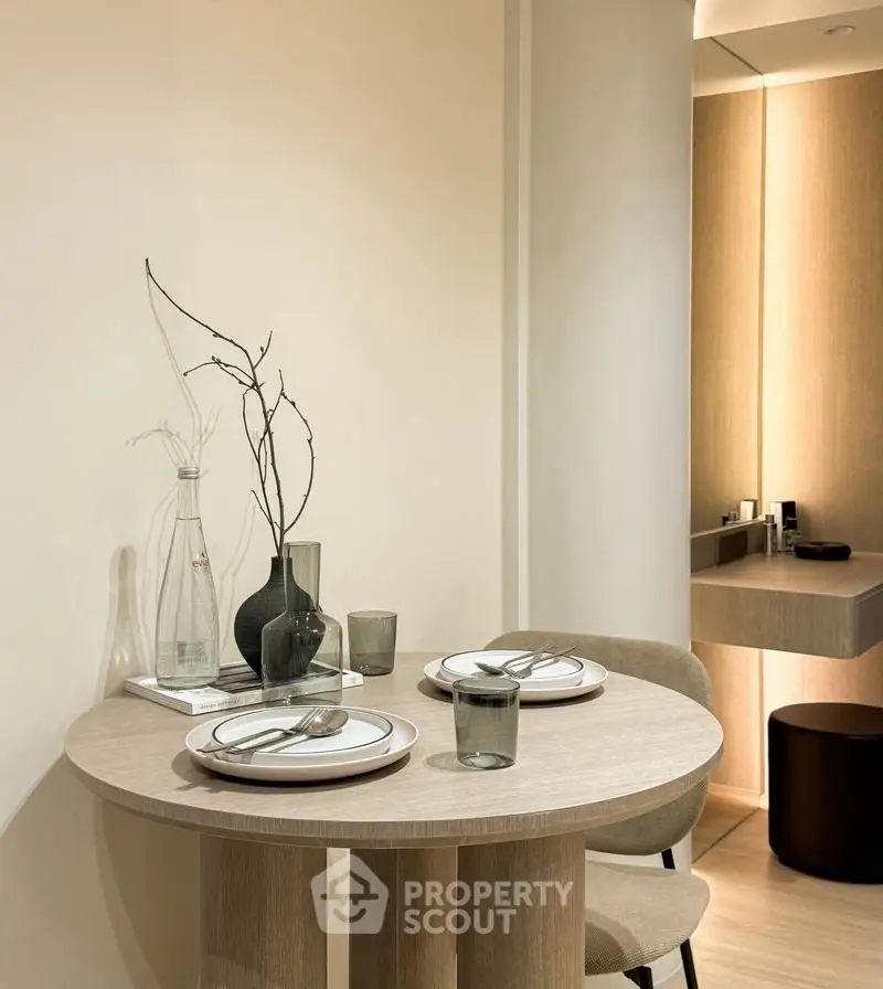 Elegant dining area with minimalist decor and soft lighting, perfect for intimate meals.