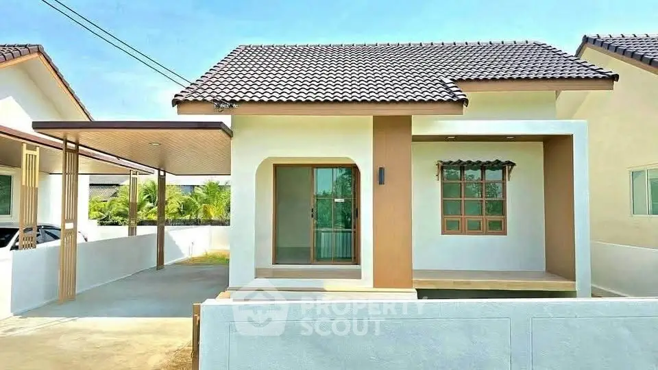 Charming single-story house with modern design and spacious driveway