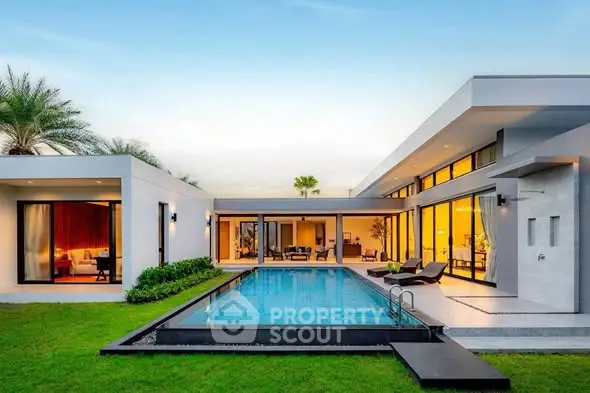 Luxurious modern villa with private pool and lush garden, perfect for serene living.