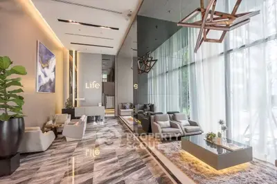 Luxurious modern living room with high ceilings and elegant decor.