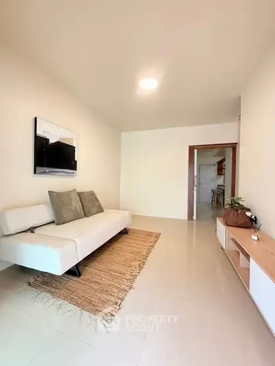 Modern living room with sleek furniture and neutral tones