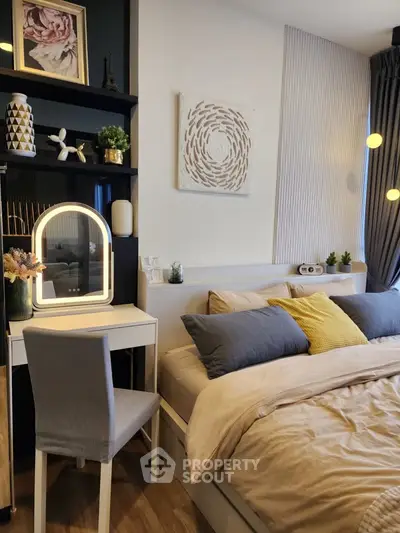 Cozy bedroom with modern decor and stylish lighting, perfect for relaxation and comfort.