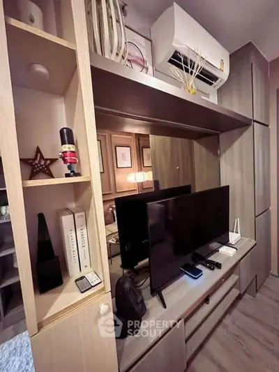 Modern living room with stylish shelving and entertainment setup