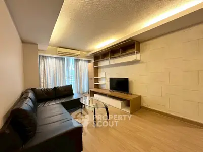 Spacious modern living room with sleek furniture and ambient lighting