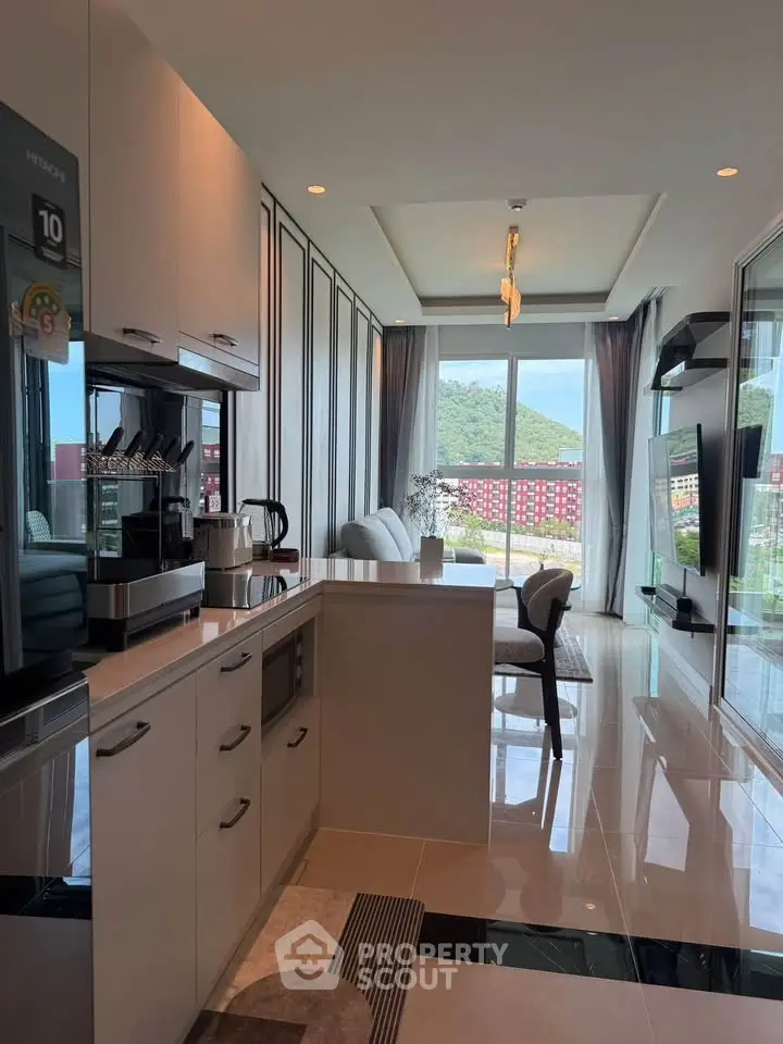 Modern open-layout kitchen and living room with scenic view