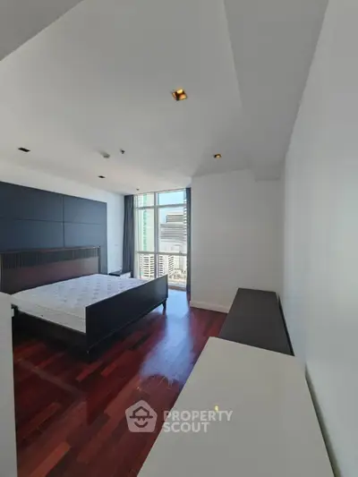 Spacious bedroom with modern design and city view