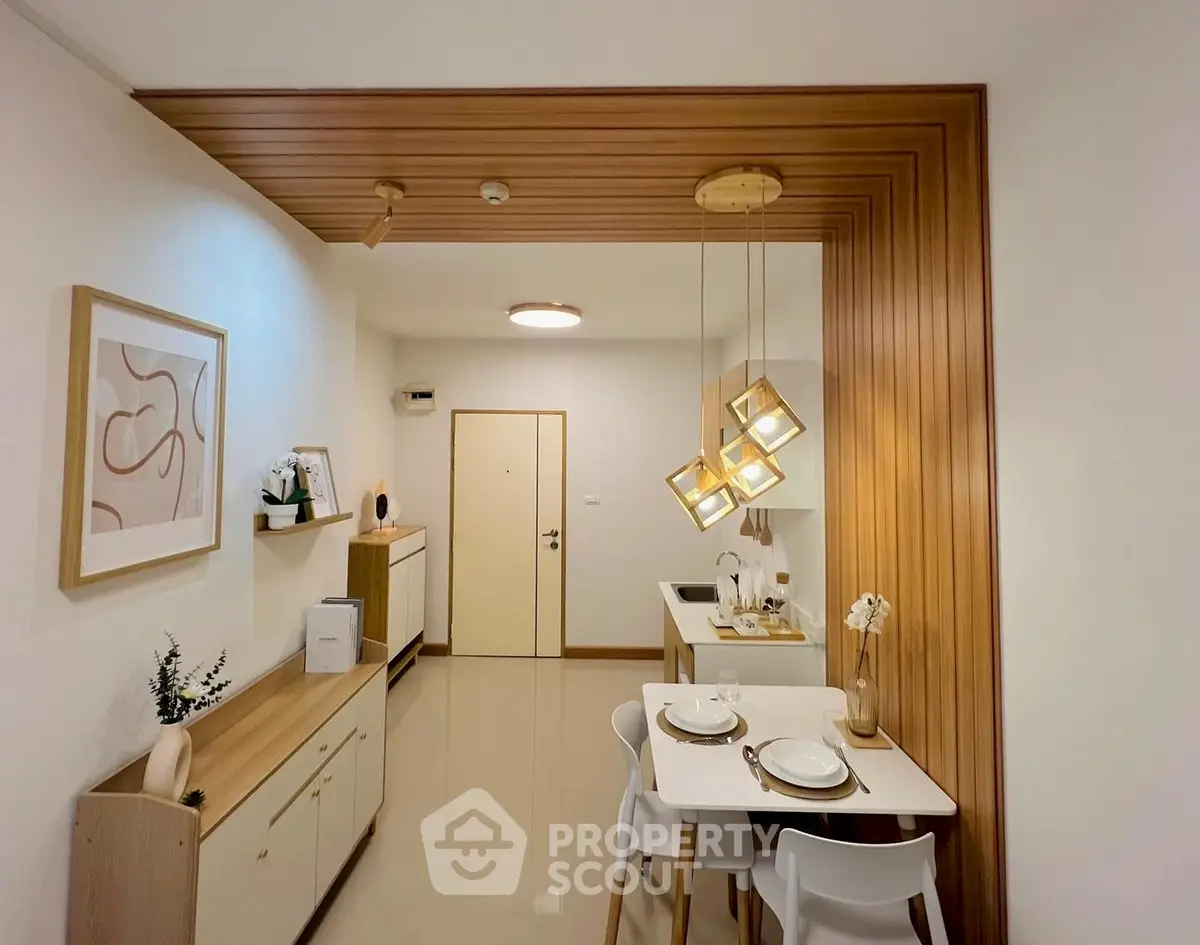 Modern dining area with stylish lighting and minimalist decor