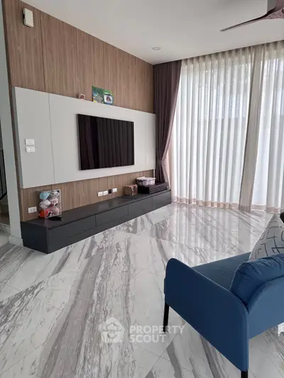 Modern living room with marble flooring and stylish TV unit