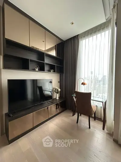 Modern living room with sleek TV unit and city view, featuring elegant decor and natural light.