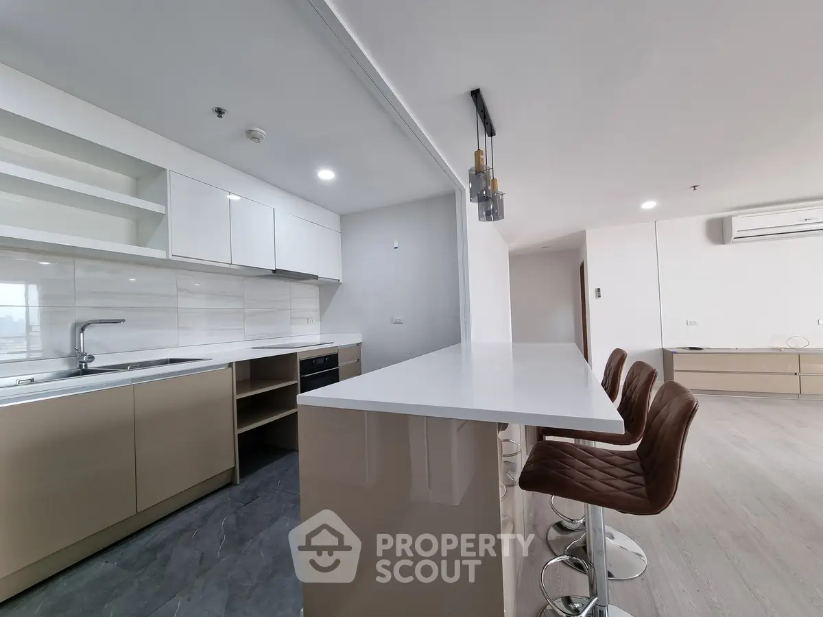 Modern kitchen with sleek design and breakfast bar seating