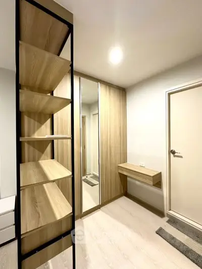 Modern minimalist bedroom with wooden wardrobe and sleek shelving unit