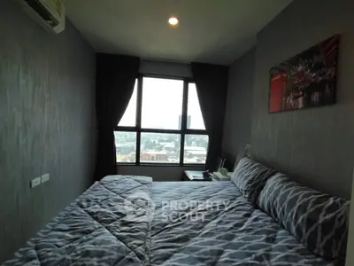 Cozy bedroom with large window offering city view, modern decor, and comfortable bedding.