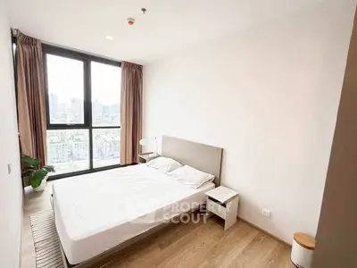 Modern bedroom with city view and natural light in high-rise apartment