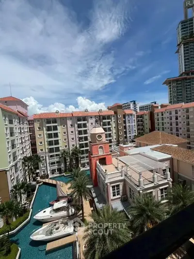 Luxurious waterfront condominium with stunning architecture and private boat dock in vibrant urban setting.