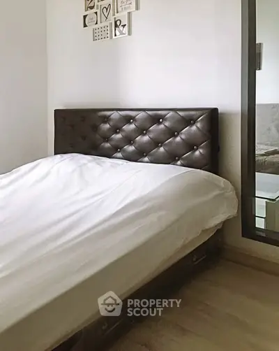 Cozy bedroom with elegant tufted headboard and minimalist decor