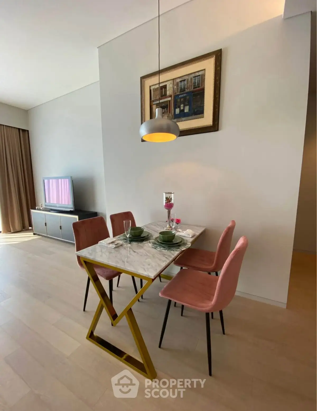 Stylish dining area with modern decor and natural light in a contemporary apartment.