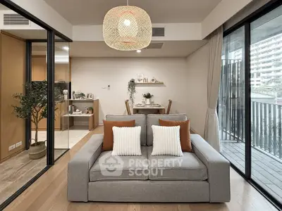 Modern living room with cozy sofa and balcony view in stylish apartment