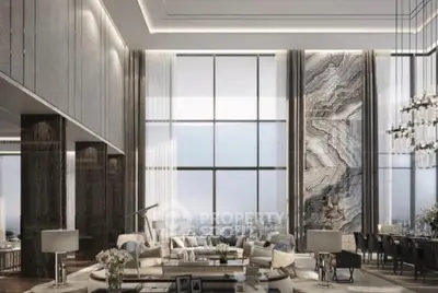 Luxurious high-ceiling living room with panoramic city views and elegant decor