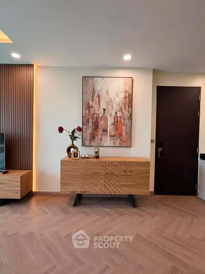 Modern living room with stylish wooden furniture and elegant wall art