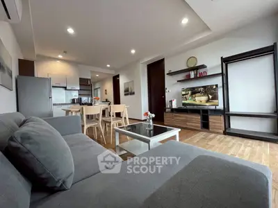Spacious modern living room with open kitchen and stylish decor