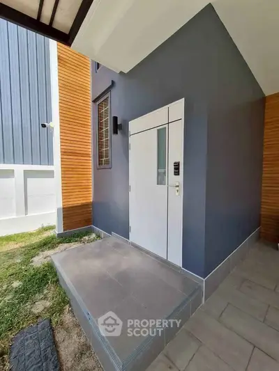 Modern entrance with sleek design and minimalist architecture