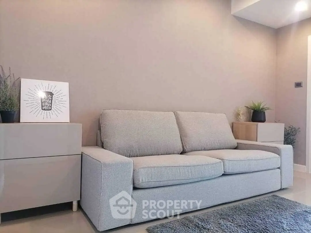 Modern living room with stylish gray sofa and elegant decor