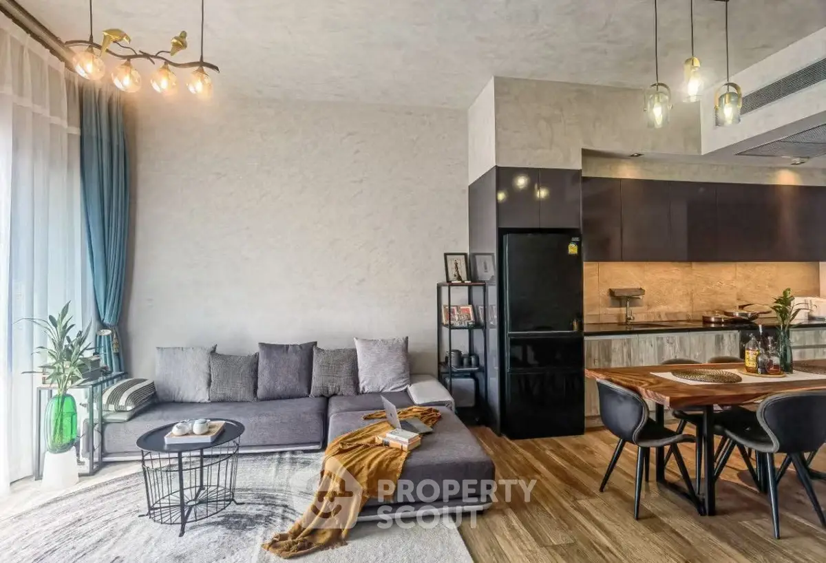 Modern living room with stylish open kitchen and cozy seating area