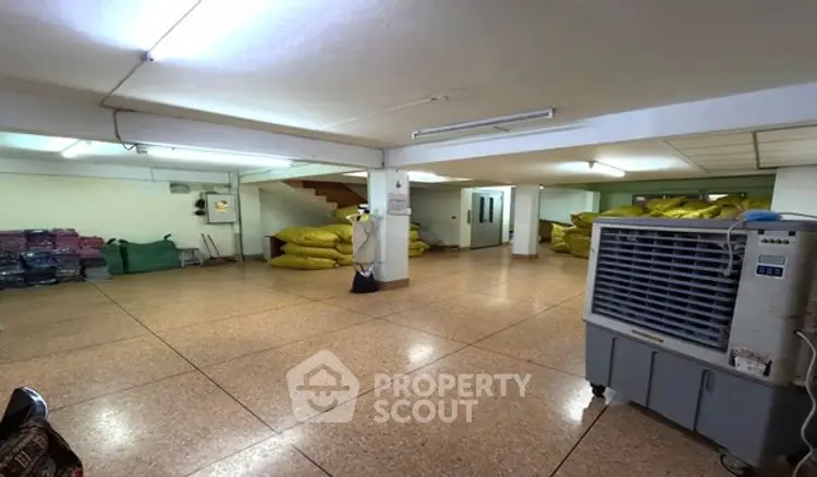 Spacious storage area with ample lighting and organized layout