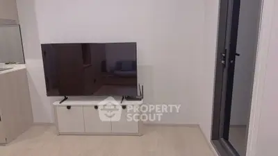 Modern living room with sleek TV setup and minimalist decor