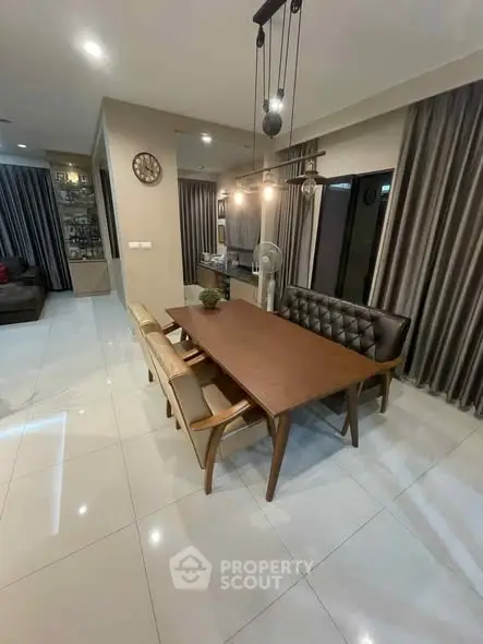 Modern dining area with stylish lighting and elegant furniture