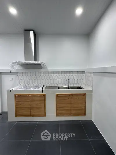 Modern kitchen with sleek cabinets and stylish backsplash