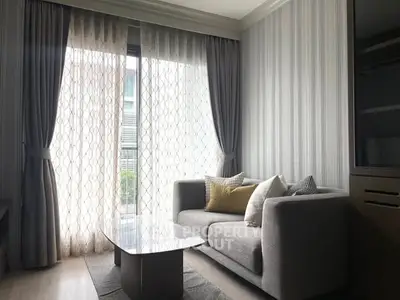 Cozy living room with modern sofa and elegant curtains in a stylish apartment.