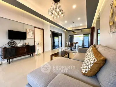 Spacious modern living room with stylish decor and ample natural light