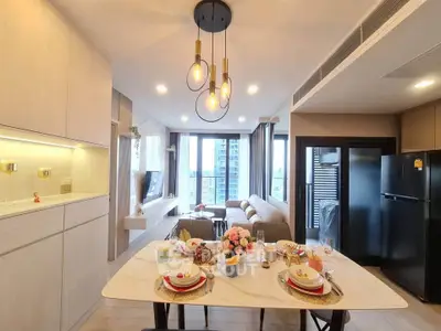 Modern open-plan living room with dining area and city view