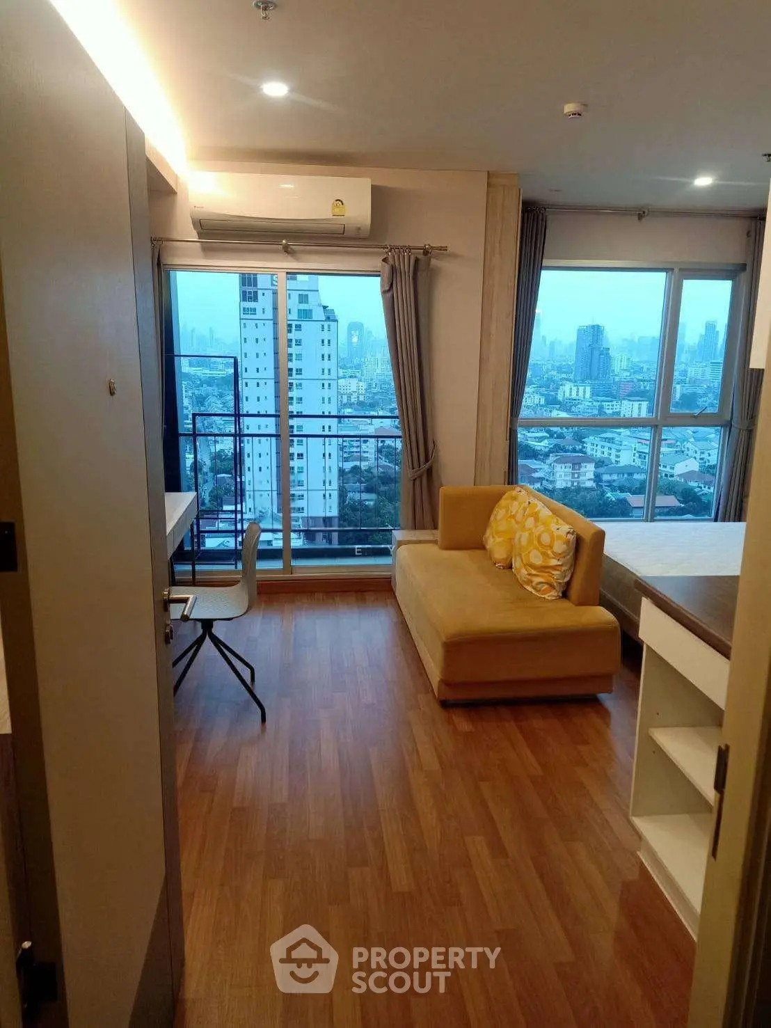 Modern apartment with stunning city view and cozy living area