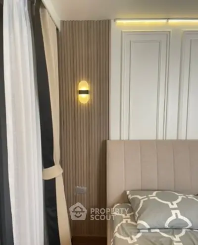 Modern bedroom with stylish lighting and elegant decor