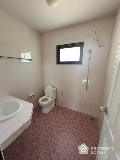 Spacious bathroom with modern fixtures and natural light