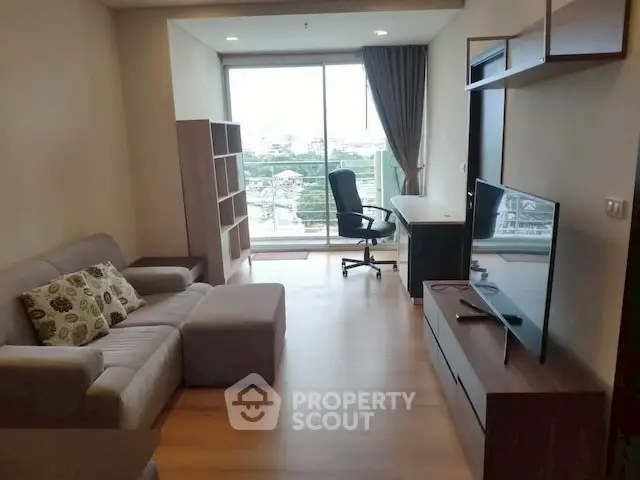 Modern living room with city view, stylish furniture, and natural light.