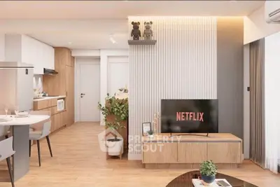 Modern open-plan living room with stylish decor and kitchen area, featuring a sleek TV setup.